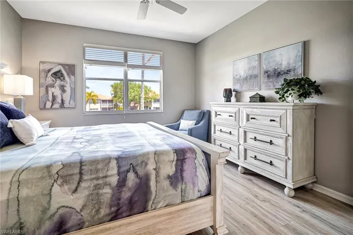 Bedroom featuring light wood-type flooring and ceiling fan