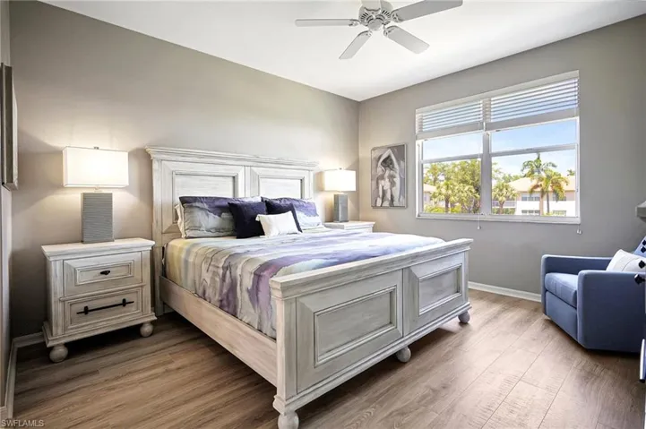 Bedroom featuring ceiling fan and dark hardwood / wood-style floors
