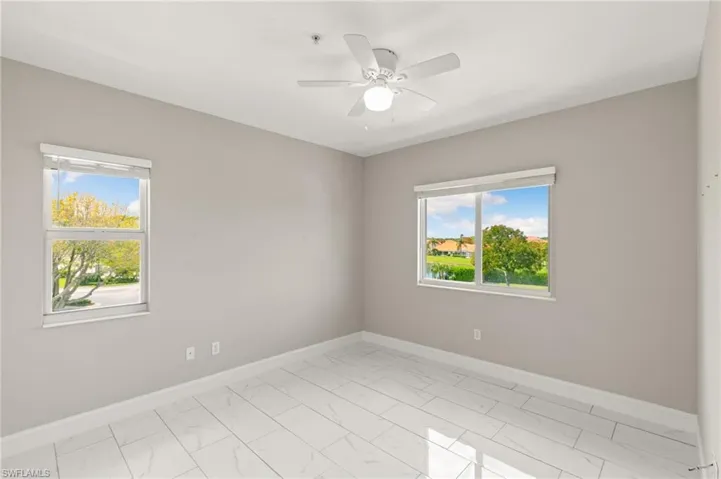 Guest bedroom #1 is light and bright with high ceilings and large closet space!