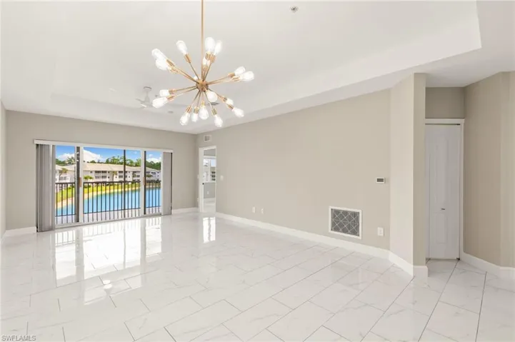 Polished porcelain tile runs throughout the entire condo keeping it light, bright, and accentuates the view!