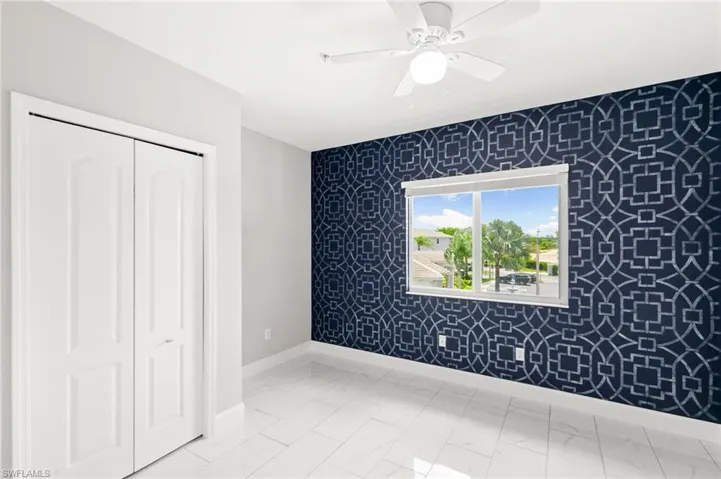 Guest bedroom #2 with custom accent wall.