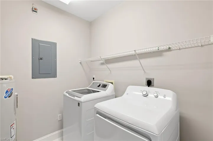 In home laundry room provides plenty of storage space and makes for doing chores a breeze!