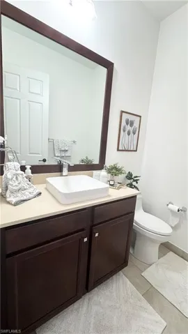 Bathroom featuring vanity and light tile patterned floors