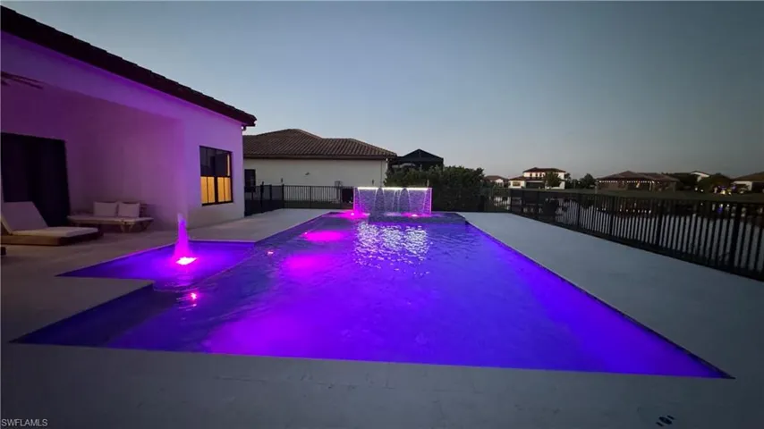 View of swimming pool featuring a fenced backyard