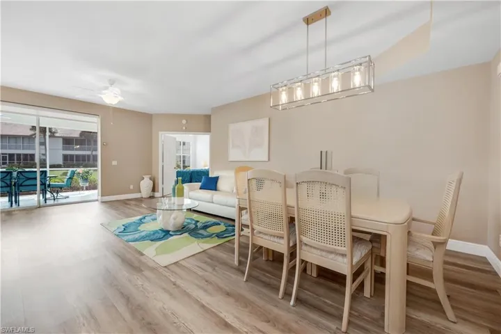 Dining space featuring light wood-style LVP flooring and a ceiling fan