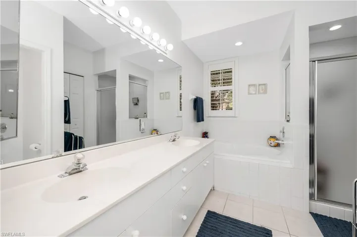 Master Full Bath with a Stall Shower, Bath tub, double vanity, and linen closet