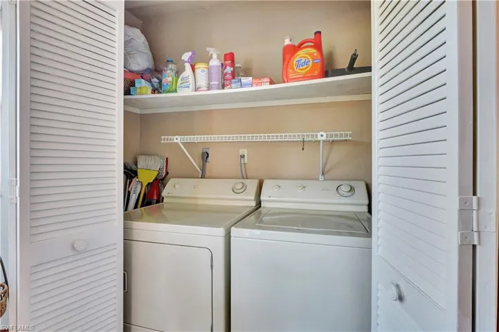 Laundry area featuring washer and clothes dryer and laundry area