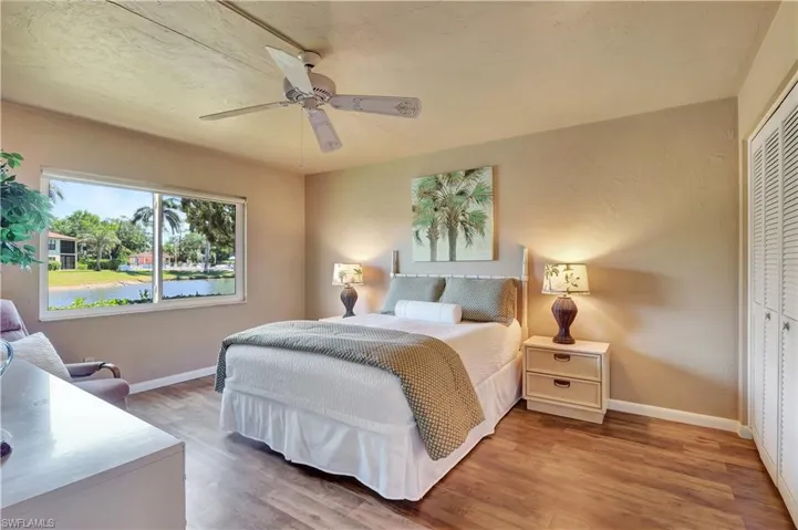 Main Bedroom with ceiling fan, and vinyl wood look flooring