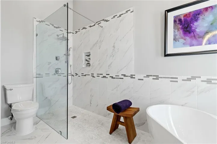Bathroom with plus walk in shower and toilet