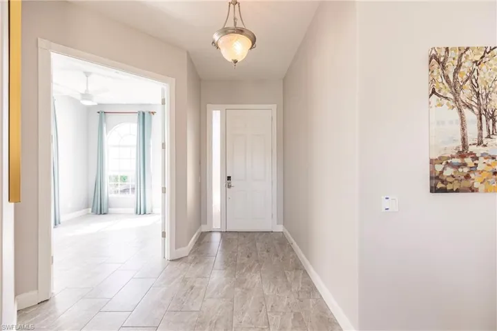 12 by 24 tile flooring throughout the home.  French doors to den or home office.