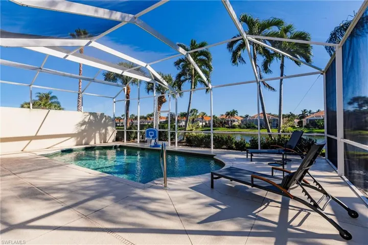 View of pool and lake from the lanai.