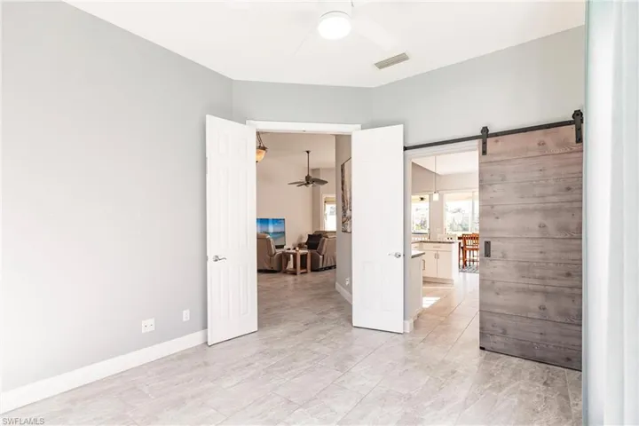 Den has barn door to the kitchen as well.