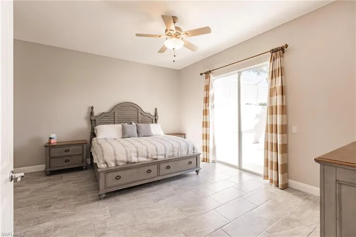 Master bedroom has slider doors to the pool area.