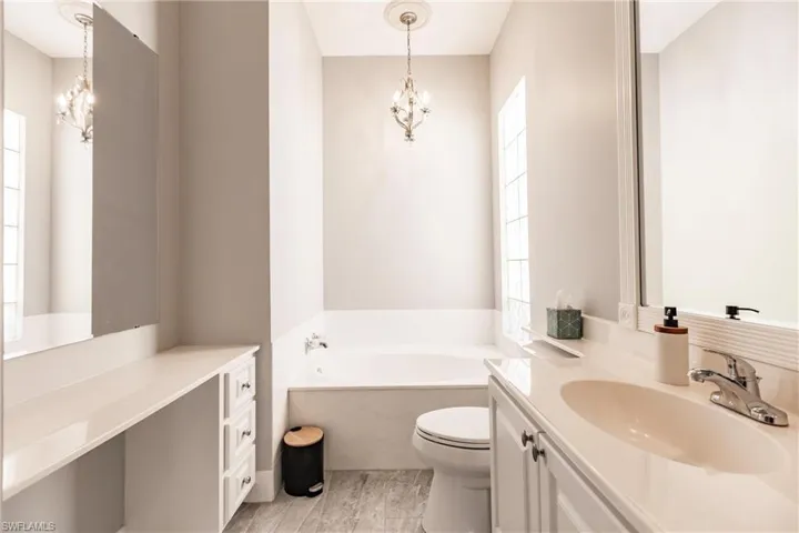 Vanity and tub on her side.