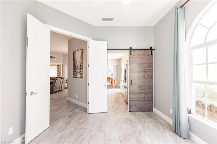 French doors from the den to foyer area.