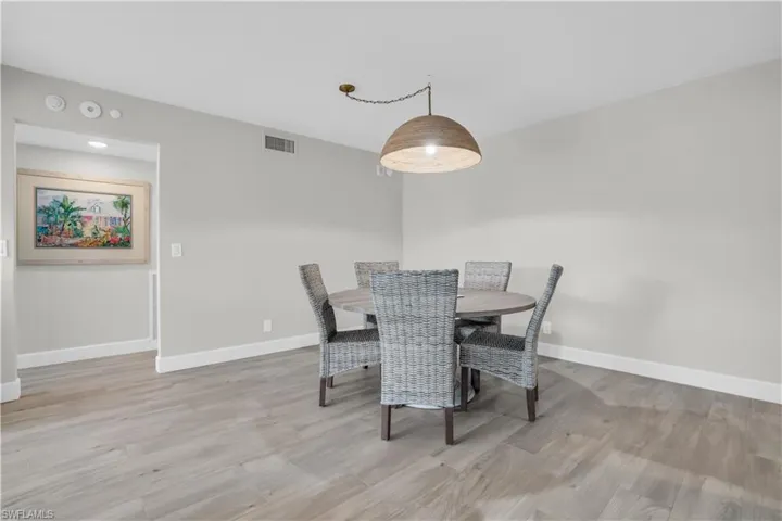 Dining space featuring hardwood / wood-style flooring