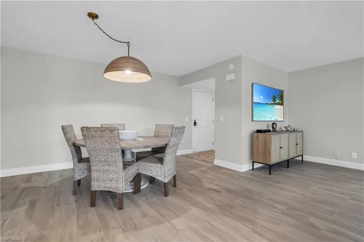 Dining area with hardwood /tile wood-style floors
