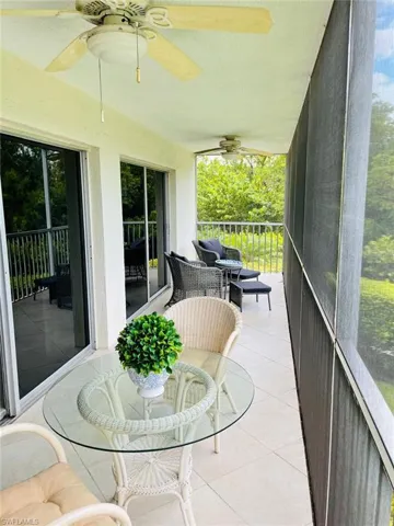 Sunroom / solarium with ceiling fan and healthy amount of natural light