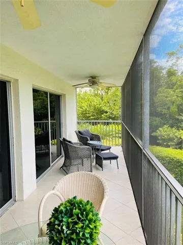 Sunroom featuring a ceiling fan