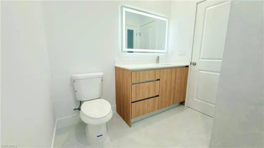 Bathroom with vanity and toilet