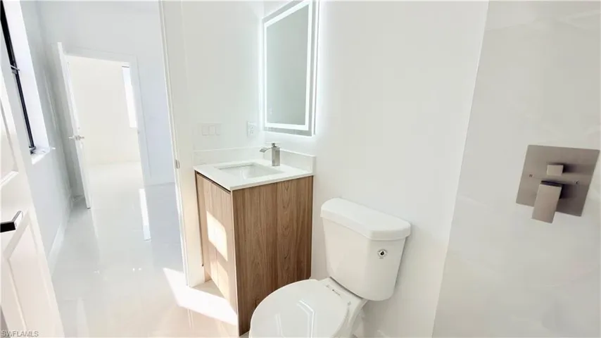 Half bathroom with toilet and vanity