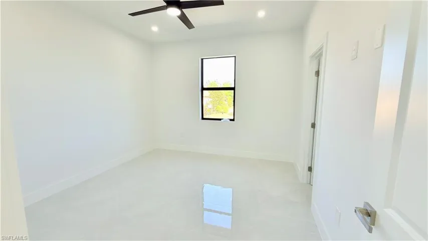 Spare room featuring recessed lighting and a ceiling fan