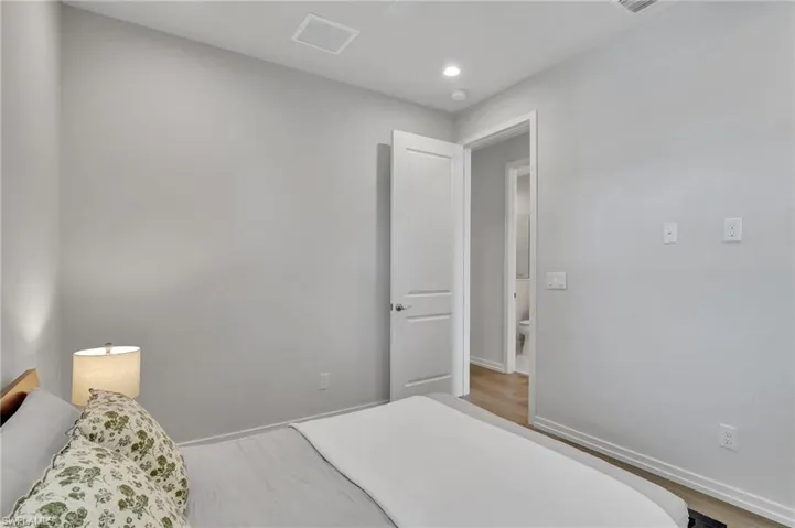 Bedroom with hardwood / wood-style floors