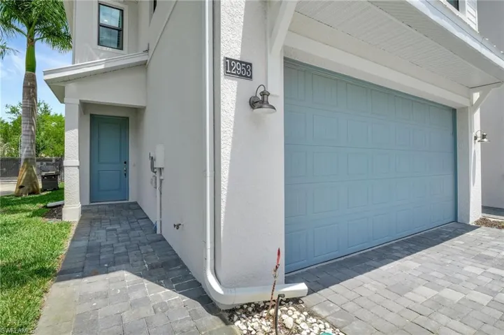 View of exterior entry featuring a garage