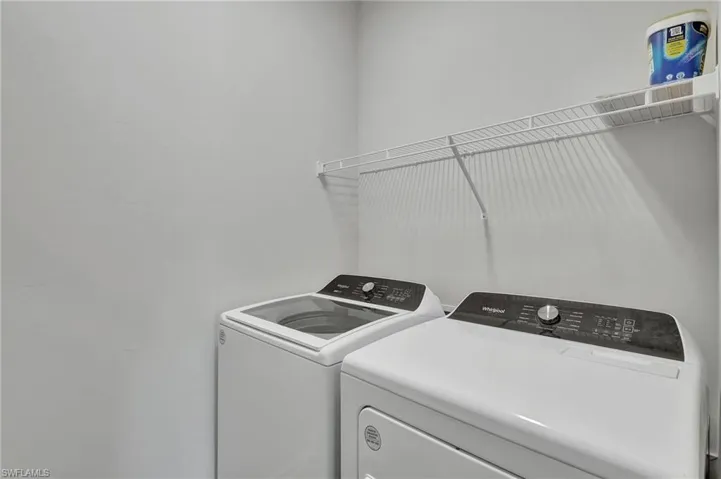 Laundry room with washing machine and dryer