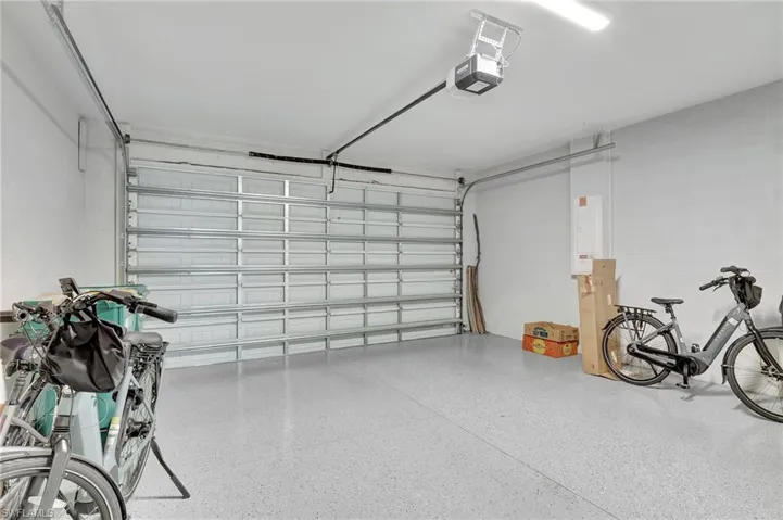 Garage featuring a garage door opener