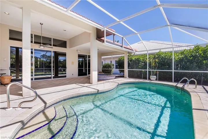Pool featuring a patio area, an in ground hot tub, a lanai, and ceiling fan