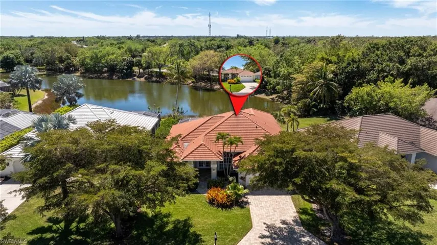 Bird's eye view featuring a wooded view and a water view