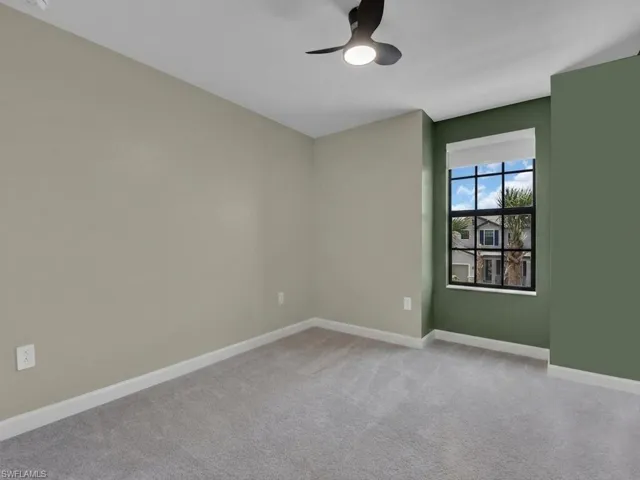 Bedroom with carpeting and ceiling fan