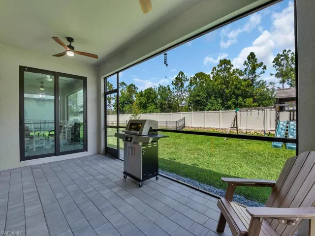 Screened in lanai with room for outdoor cooking and dining