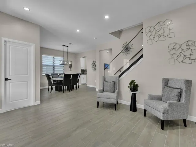 Front entry with living room, dining room and natural light