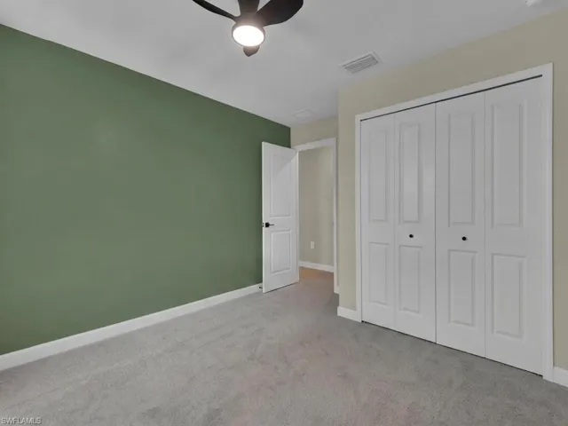 Bedroom with large bi-fold closet