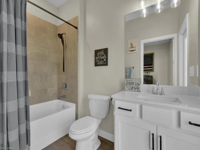 Guest bathroom with shower/tub combo, and sink/vanity