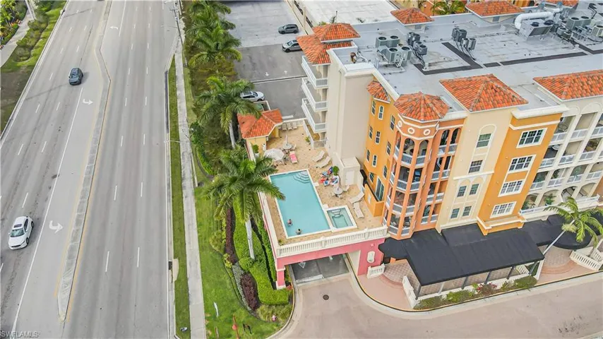 Bird's eye view of apartment complex / building and a pool
