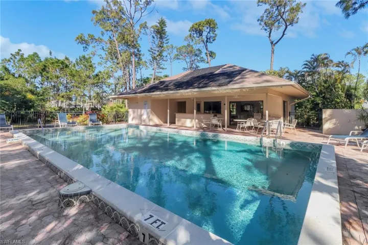 Community pool featuring a patio area