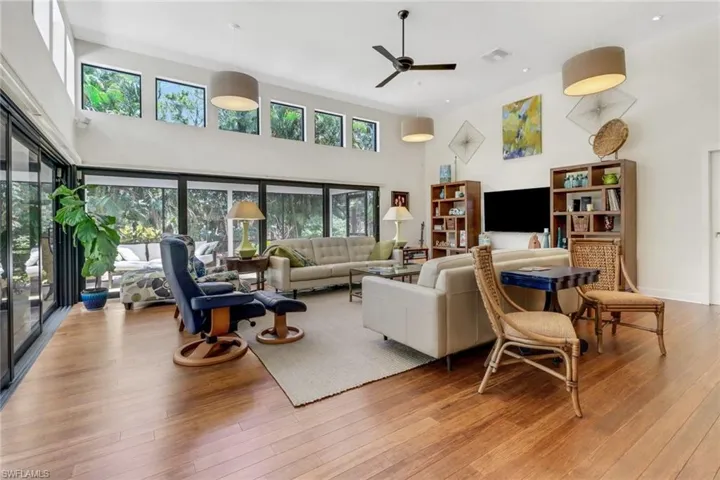 Spacious Great Room with Volume Ceiling 12.6 Height Two walls of Stack Back Sliding Glass Door & Clerestory Windows are Hurricane Impact