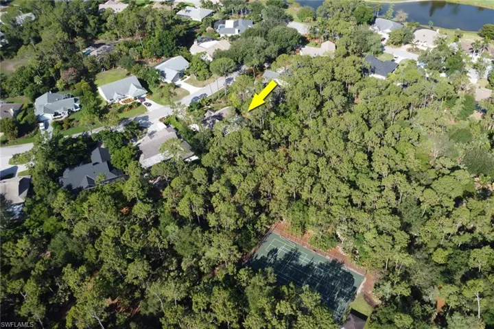 Aerial view of property's location featuring the preserve and tennis court/ pickle ball court