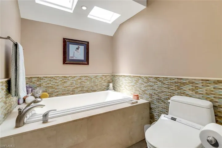 Primary Bathroom, Toto Jetted Soak Tub, Toto Water Closet & Bidet, Impact Sky Lights above soak tub