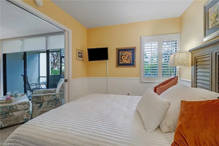 Carpeted bedroom featuring access to outside