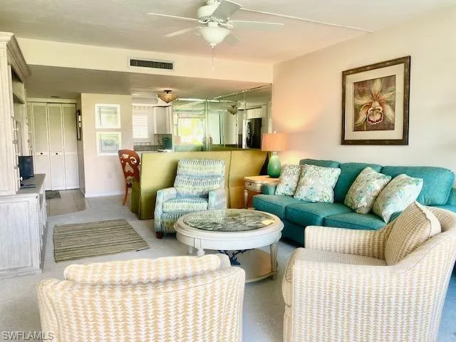 Living room featuring ceiling fan