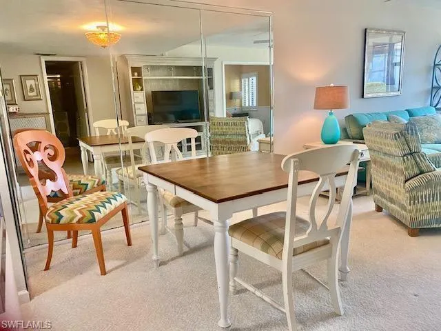 View of carpeted dining space