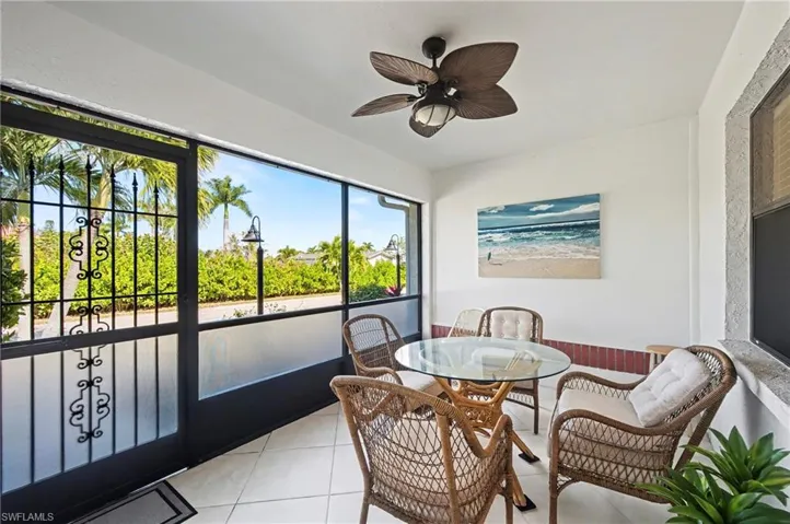 Sunroom featuring tile  flooring