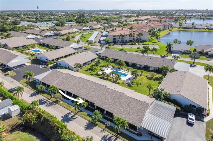 Aerial perspective of suburban area with a large body of water