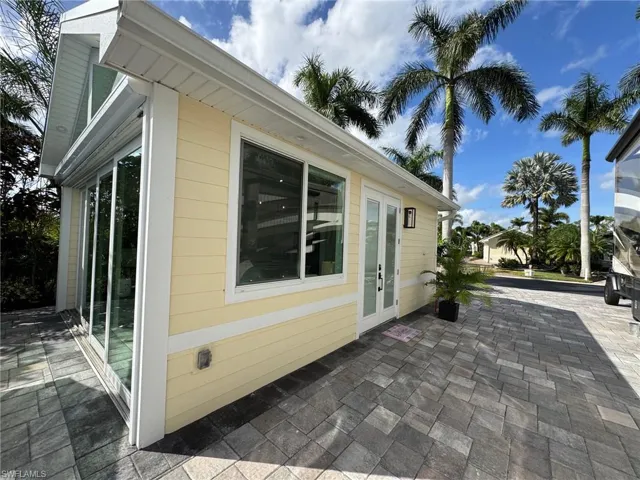 View of side of home featuring a patio