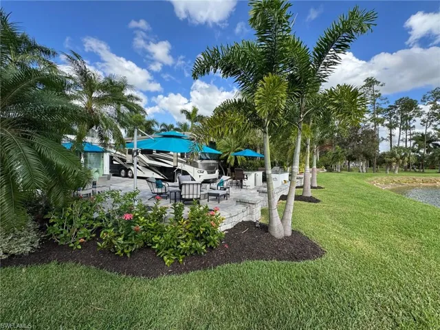 View of yard featuring a water view and a patio