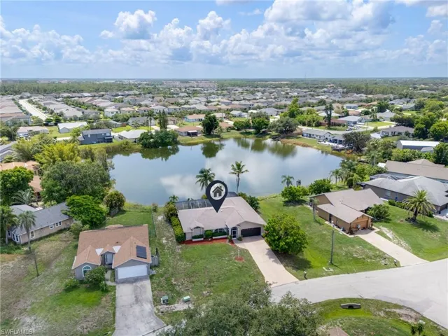 Aerial perspective of suburban area with a large body of water